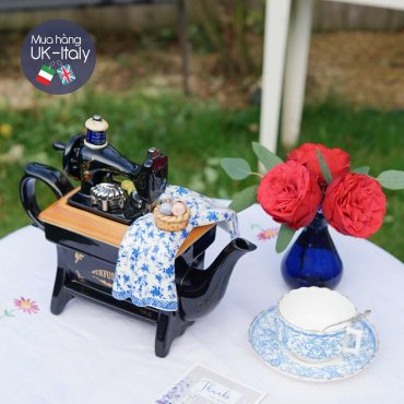 Ấm bày máy khâu to vải hoa xanh trắng